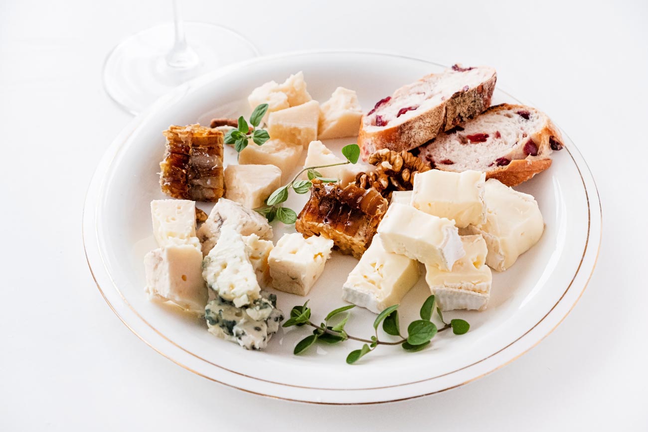 A plate of various cheese and breads